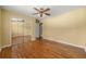 Bedroom with hardwood floors, a ceiling fan, and mirrored closet at 2262 Hurt Sw Rd, Marietta, GA 30008