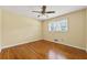 Sunlit bedroom featuring hardwood floors and a ceiling fan at 2262 Hurt Sw Rd, Marietta, GA 30008