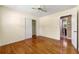 Bright bedroom featuring hardwood floors, ceiling fan, and closet at 2262 Hurt Sw Rd, Marietta, GA 30008