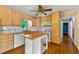 Bright kitchen features an island, tile backsplash, and ample cabinet space at 2262 Hurt Sw Rd, Marietta, GA 30008