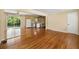 Living area featuring hardwood floors, kitchen access and sliding glass doors at 2262 Hurt Sw Rd, Marietta, GA 30008