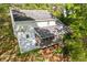 Aerial view of home featuring a screened-in porch overlooking a wooded backyard at 2315 Fisher Dr, Loganville, GA 30052