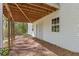 Spacious backyard with a covered patio and wooded surroundings for outdoor relaxation at 2315 Fisher Dr, Loganville, GA 30052