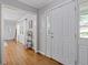 Bright entryway featuring hardwood floors, a coat closet, and a view into the spacious living areas at 2315 Fisher Dr, Loganville, GA 30052