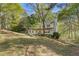 Charming two-story home with a welcoming front porch and well-maintained lawn in a wooded neighborhood at 2315 Fisher Dr, Loganville, GA 30052