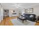 Elegant living room showcasing hardwood floors, comfortable seating, and seamless transition to dining area at 2315 Fisher Dr, Loganville, GA 30052