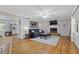 Inviting living room with hardwood floors, fireplace, neutral paint, and ample natural light at 2315 Fisher Dr, Loganville, GA 30052