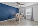 Bright office space with a modern desk, custom accent wall, and ample natural light at 2315 Fisher Dr, Loganville, GA 30052