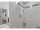 Beautiful, tiled walk-in shower with a rain shower head and elegant mosaic accents at 2315 Fisher Dr, Loganville, GA 30052