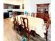 Traditional dining room boasts hardwood floors, an antique china cabinet, and a matching dining table at 6408 Kennonbriar Ct, Lithonia, GA 30058