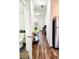 Welcoming foyer with stylish wood-look flooring, complemented by a console table and decor at 6408 Kennonbriar Ct, Lithonia, GA 30058