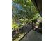 Enjoy the view from this balcony overlooking mature trees and a lush landscape at 6851 Roswell Rd # O10, Atlanta, GA 30328