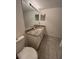 Bathroom featuring stylish vanity with granite countertop and tiled floor at 6851 Roswell Rd # O10, Atlanta, GA 30328