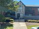 Charming two-story townhome with a manicured front yard and welcoming entrance at 6851 Roswell Rd # O10, Atlanta, GA 30328
