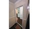 Inviting hallway with elegant trim and doorway view of built in bookshelf at 6851 Roswell Rd # O10, Atlanta, GA 30328