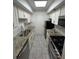 Efficient kitchen with white cabinets, stainless steel appliances, and granite countertops at 6851 Roswell Rd # O10, Atlanta, GA 30328