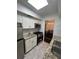 Bright kitchen with white cabinets, stainless steel appliances and granite countertops at 6851 Roswell Rd # O10, Atlanta, GA 30328