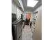Galley kitchen featuring stainless steel appliances and granite countertops, with dining room access at 6851 Roswell Rd # O10, Atlanta, GA 30328