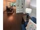 Inviting living room features warm wood floors, built in bookcase, and comfortable seating at 6851 Roswell Rd # O10, Atlanta, GA 30328