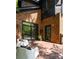 Outdoor back deck with chairs featuring brick architecture and natural lighting at 2015 N Decatur Ne Rd, Atlanta, GA 30307
