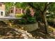 Landscaped backyard offers a multi-level stone walkway and lush plantings at 2015 N Decatur Ne Rd, Atlanta, GA 30307