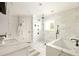 Modern bathroom featuring double sinks, marble finishes, and a glass-enclosed shower at 2015 N Decatur Ne Rd, Atlanta, GA 30307