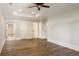 Spacious bedroom with hardwood floors, tray ceiling, and a view of two open doorways at 2015 N Decatur Ne Rd, Atlanta, GA 30307