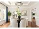 Bright dining room featuring modern lighting, hardwood floors, and large windows at 2015 N Decatur Ne Rd, Atlanta, GA 30307