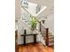 Elegant foyer featuring hardwood floors, a staircase with iron balusters, and a view of the upper level at 2015 N Decatur Ne Rd, Atlanta, GA 30307