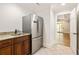 An attractive kitchenette with stainless steel refrigerator, sink, granite countertop and wood cabinets at 2015 N Decatur Ne Rd, Atlanta, GA 30307