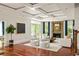 Elegant living room with coffered ceiling, fireplace, and views of the outside deck and backyard at 2015 N Decatur Ne Rd, Atlanta, GA 30307