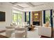 Bright living room featuring a stone fireplace, neutral furniture, and natural light at 2015 N Decatur Ne Rd, Atlanta, GA 30307