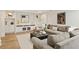A cozy living room with a large gray sectional sofa and custom built-in cabinets at 2015 N Decatur Ne Rd, Atlanta, GA 30307