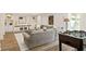 A cozy living room with a large gray sectional sofa and custom built-in cabinets at 2015 N Decatur Ne Rd, Atlanta, GA 30307