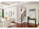Bright living room with hardwood floors, contemporary furniture, and stairway access at 2015 N Decatur Ne Rd, Atlanta, GA 30307