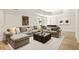 Modern living room featuring a sectional couch and neutral decor at 2015 N Decatur Ne Rd, Atlanta, GA 30307