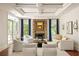 Spacious living room with stone fireplace, lots of natural light, and sophisticated decor at 2015 N Decatur Ne Rd, Atlanta, GA 30307