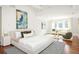 Sunlit main bedroom with a sitting area and decorative wall art at 2015 N Decatur Ne Rd, Atlanta, GA 30307