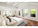 Spacious main bedroom with hardwood floors, sitting area, and balcony access at 2015 N Decatur Ne Rd, Atlanta, GA 30307