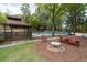 Inviting backyard featuring a pool, gazebo, outdoor seating area, and lush landscaping, perfect for relaxation and entertaining at 5300 Coacoochee Ter, Johns Creek, GA 30022
