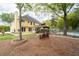 The backyard features a charming gazebo, a seating area with a firepit, and a pool providing a delightful outdoor space at 5300 Coacoochee Ter, Johns Creek, GA 30022