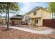 Charming backyard highlighting a gazebo, landscaped features, lush trees, and a view of the home's exterior at 5300 Coacoochee Ter, Johns Creek, GA 30022