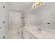 Bathroom with single sink, toilet, and shower/tub combo at 5300 Coacoochee Ter, Johns Creek, GA 30022