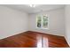 Bedroom featuring hardwood floors and natural light at 5300 Coacoochee Ter, Johns Creek, GA 30022