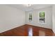 Bedroom featuring hardwood floors and natural light at 5300 Coacoochee Ter, Johns Creek, GA 30022