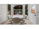 Bright breakfast nook features a table and view of the covered outdoor dining area at 5300 Coacoochee Ter, Johns Creek, GA 30022