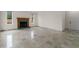 Bright living room featuring a green marble fireplace and marble flooring at 5300 Coacoochee Ter, Johns Creek, GA 30022