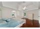 Expansive main bedroom offers hardwood floors, tray ceiling, and bright natural light at 5300 Coacoochee Ter, Johns Creek, GA 30022