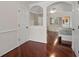 Beautiful bedroom features hardwood floors and view into sleeping area at 5300 Coacoochee Ter, Johns Creek, GA 30022