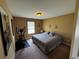 Bright bedroom featuring a comfortable bed and ample space for exercise equipment at 1598 Lenox Overlook Ne Rd, Atlanta, GA 30329